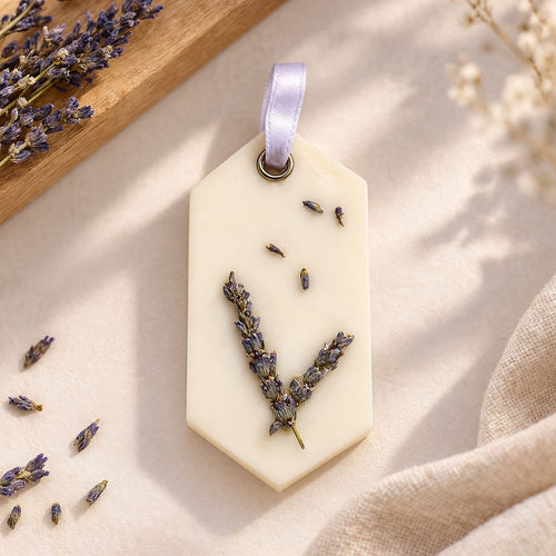 Handcrafted lavender wax sachet decorated with dried lavender flowers and a satin ribbon by Hallow Glow